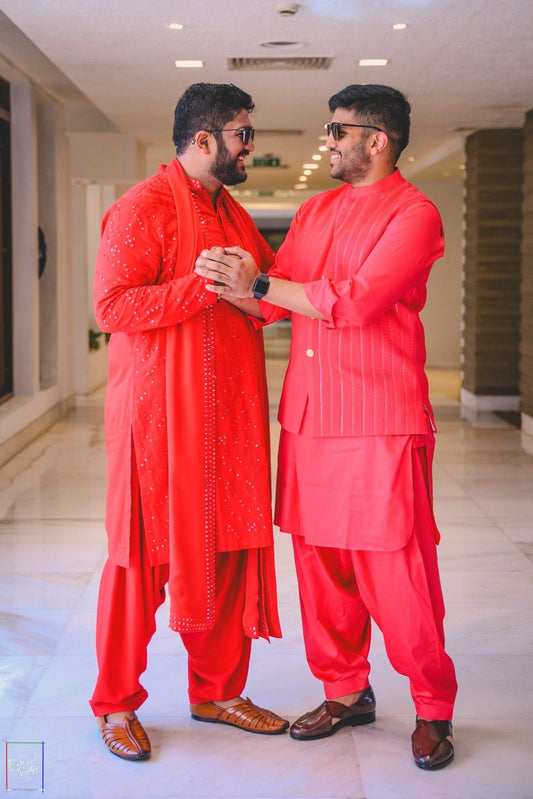 Left- Red Embroidered Kurta Set with Dupatta, Right Coral Bundi Jacket Set